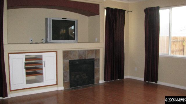 1751 Trek Trail Reno, NV 89521 - Photo 6 of 7 a view of an empty room with wooden floor and a window