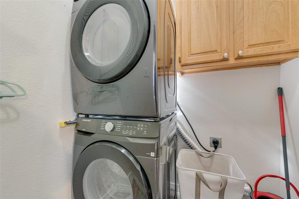 106 Villanova Circle Forney, TX 75126 - Photo 13 of 26 a close view of a utility room with dryer and washer