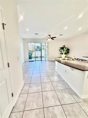 a hallway with a black white checkered floor
