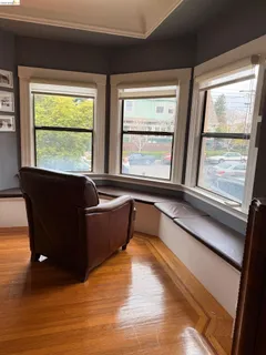 a living room with furniture and windows