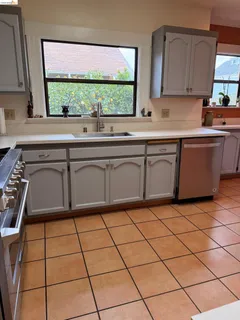 a kitchen with a sink and a large window