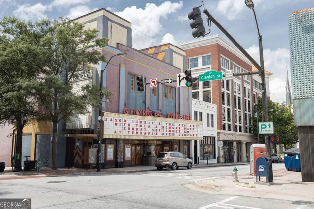 a view of a chairs and table in the balcony