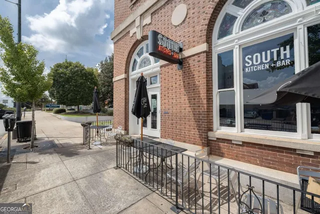 a view of a street with stores