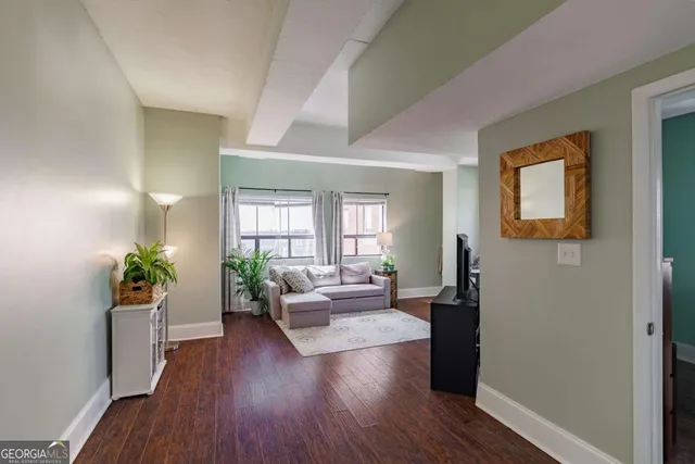 a living room with furniture and a large window