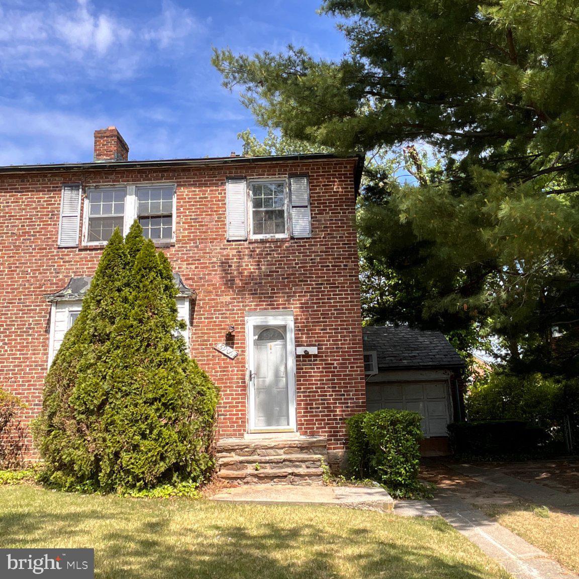 5906 Ayleshire Road Baltimore, MD 21239 - Photo 1 of 41 Charming brick home with lush greenery.