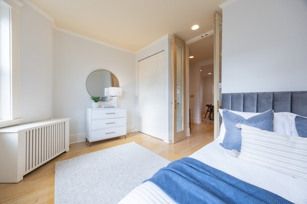58 Dwight Street, Unit 6 Brookline, MA 02446 - Photo 15 of 21 a living room with furniture and a wooden floor