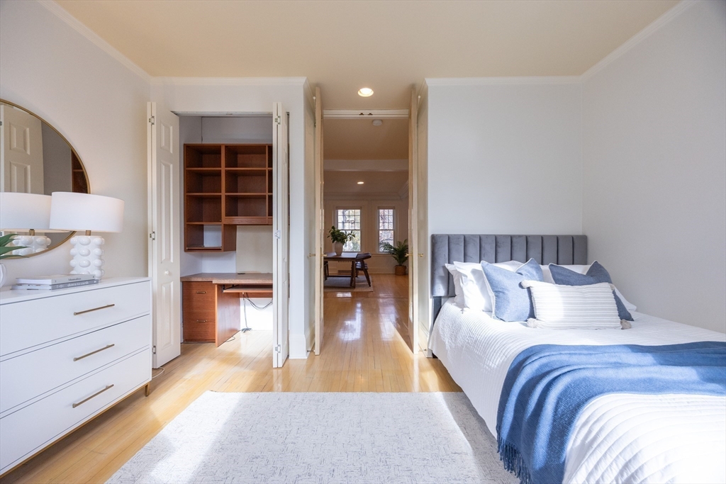 58 Dwight Street, Unit 6 Brookline, MA 02446 - Photo 17 of 21 a bed room with a bed and walk in closet