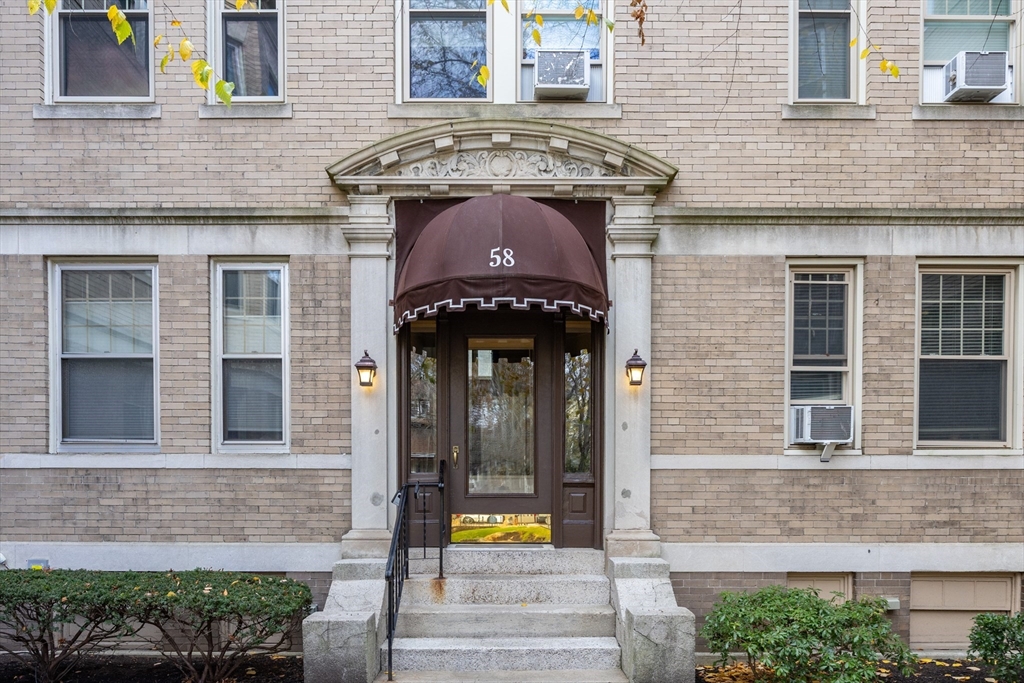 58 Dwight Street, Unit 6 Brookline, MA 02446 - Photo 20 of 21 a front view of a house with a garden
