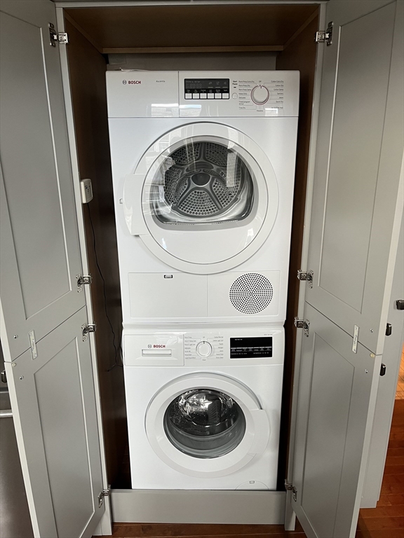 58 Dwight Street, Unit 6 Brookline, MA 02446 - Photo 21 of 21 a utility room with dryer and washer