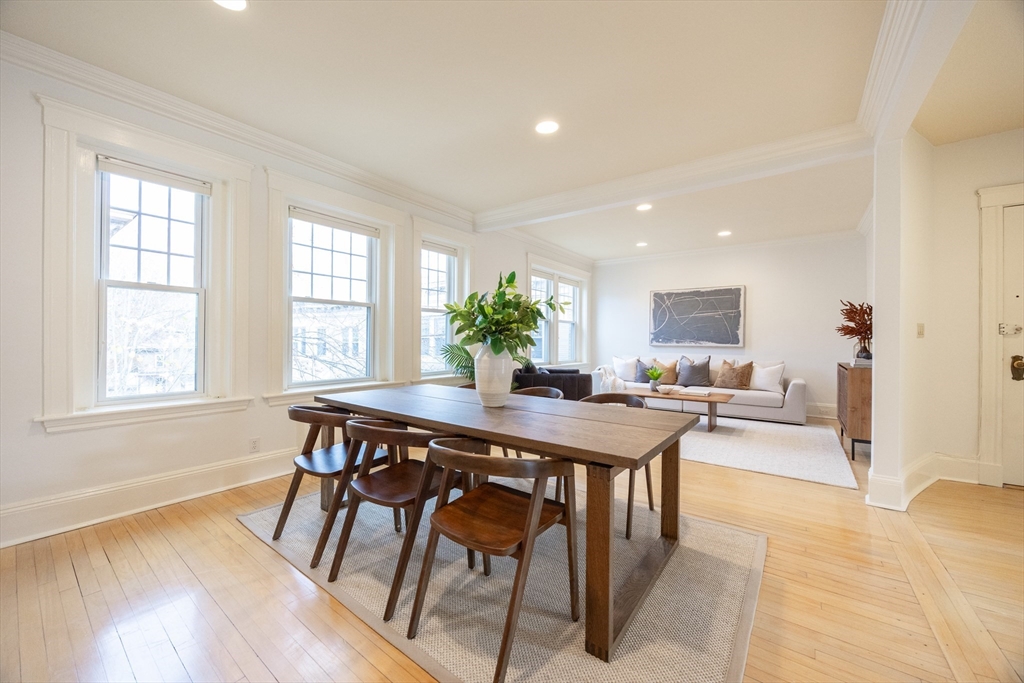 58 Dwight Street, Unit 6 Brookline, MA 02446 - Photo 4 of 21 a view of a dining room with furniture and wooden floor