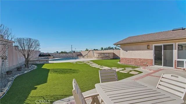 a view of a patio with swimming pool