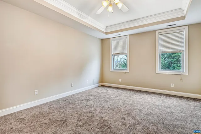 an empty room with a empty space and a ceiling fan