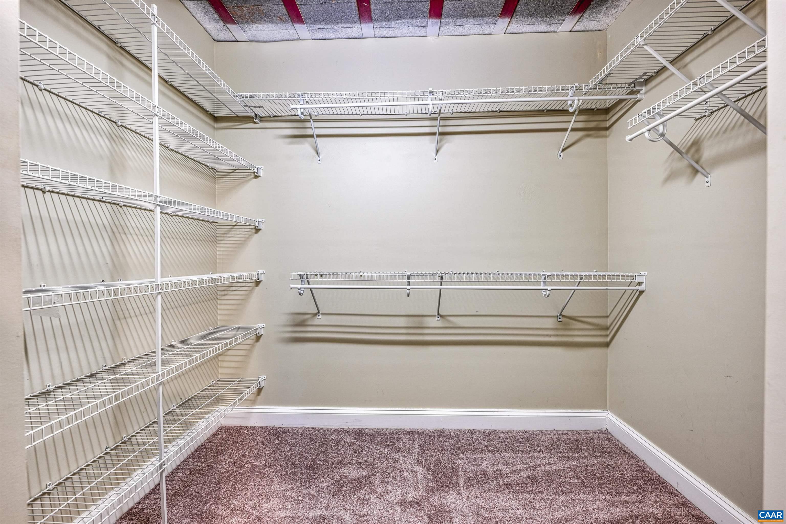 4885 Mechums River Road Charlottesville, VA 22901 - Photo 26 of 72 a view of walk in closet with empty racks
