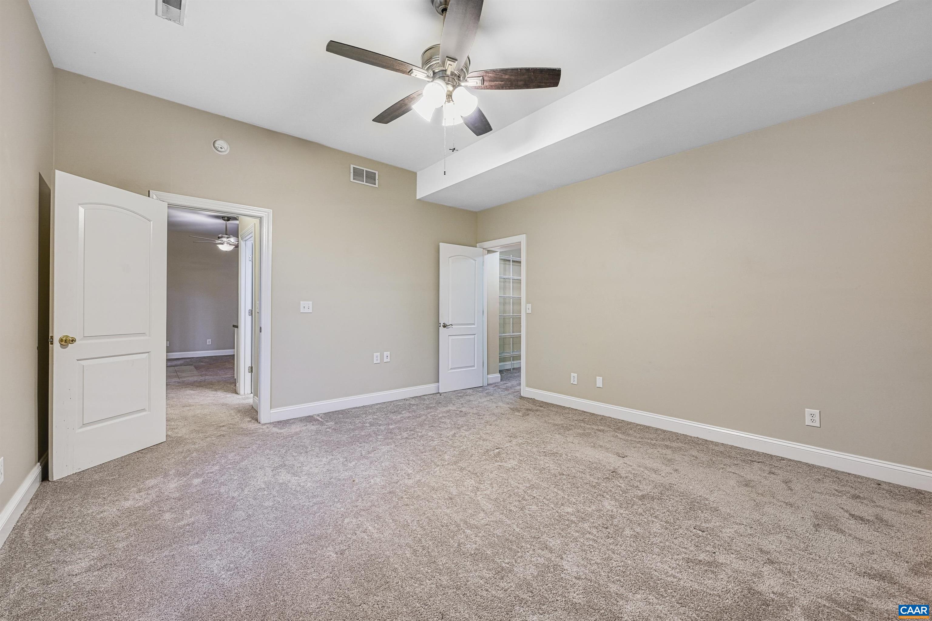 4885 Mechums River Road Charlottesville, VA 22901 - Photo 32 of 72 a view of an empty room and a ceiling fan