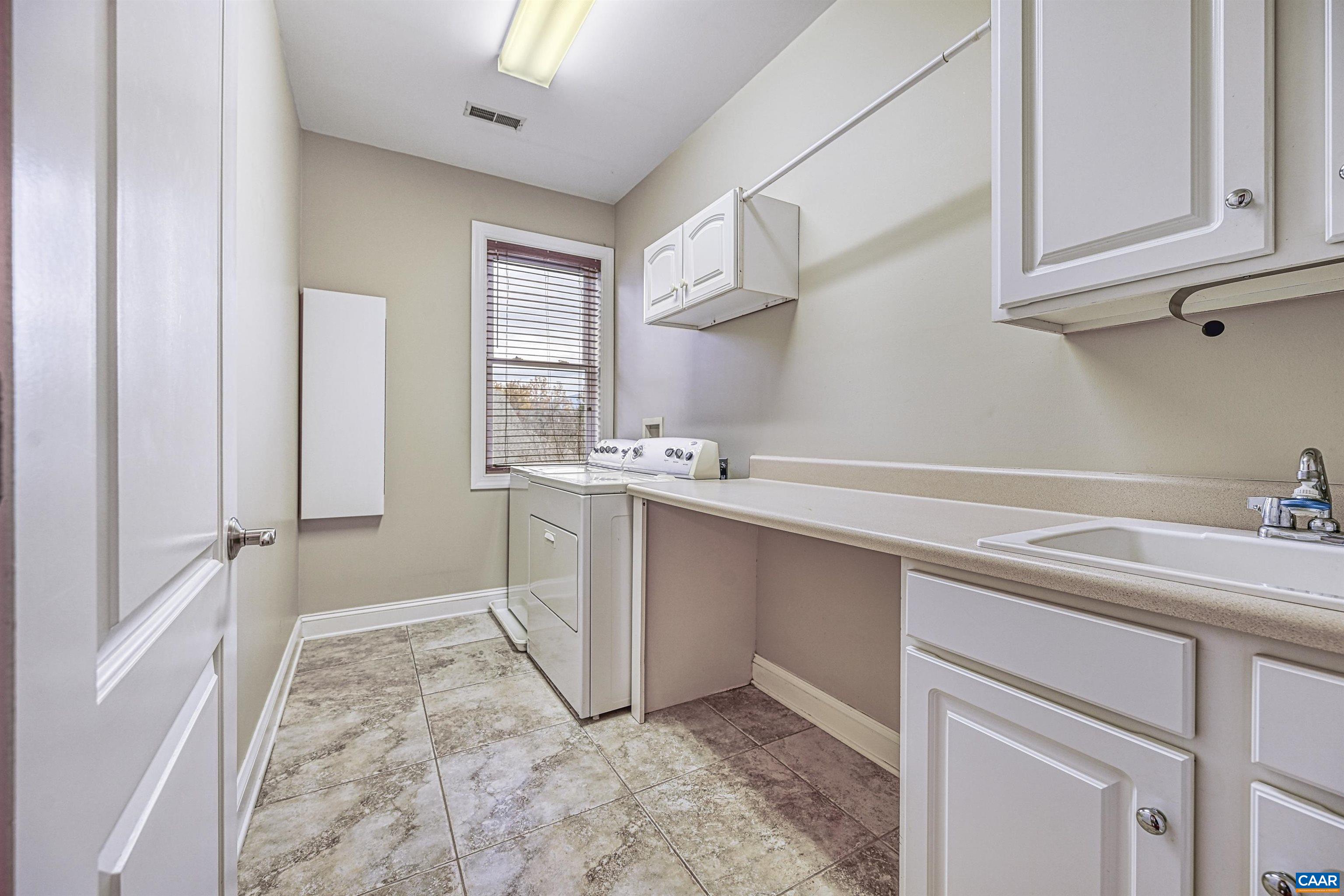 4885 Mechums River Road Charlottesville, VA 22901 - Photo 33 of 72 a room with a sink cabinets and utility room