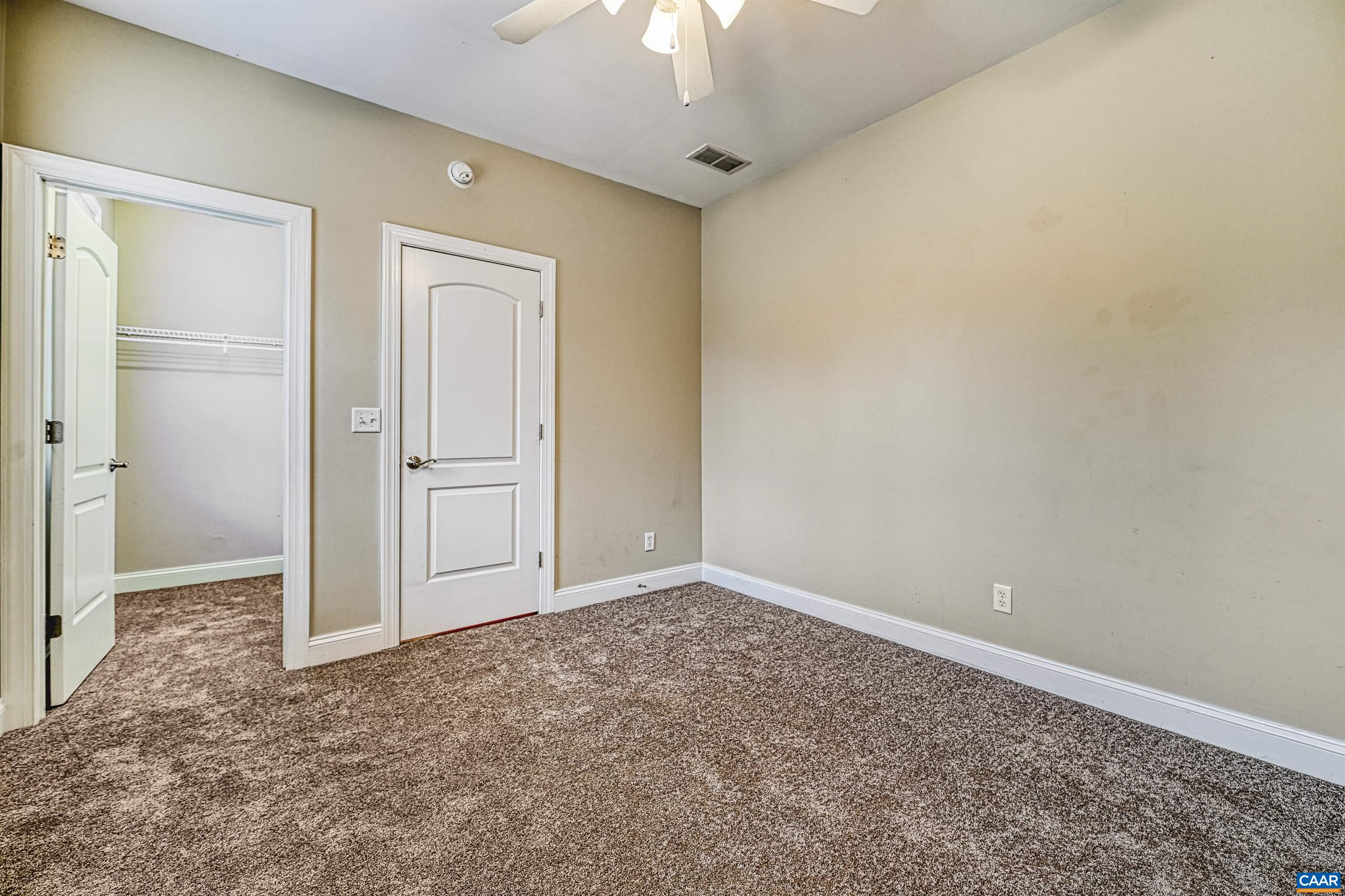 4885 Mechums River Road Charlottesville, VA 22901 - Photo 41 of 72 an empty room with a empty space and a ceiling fan