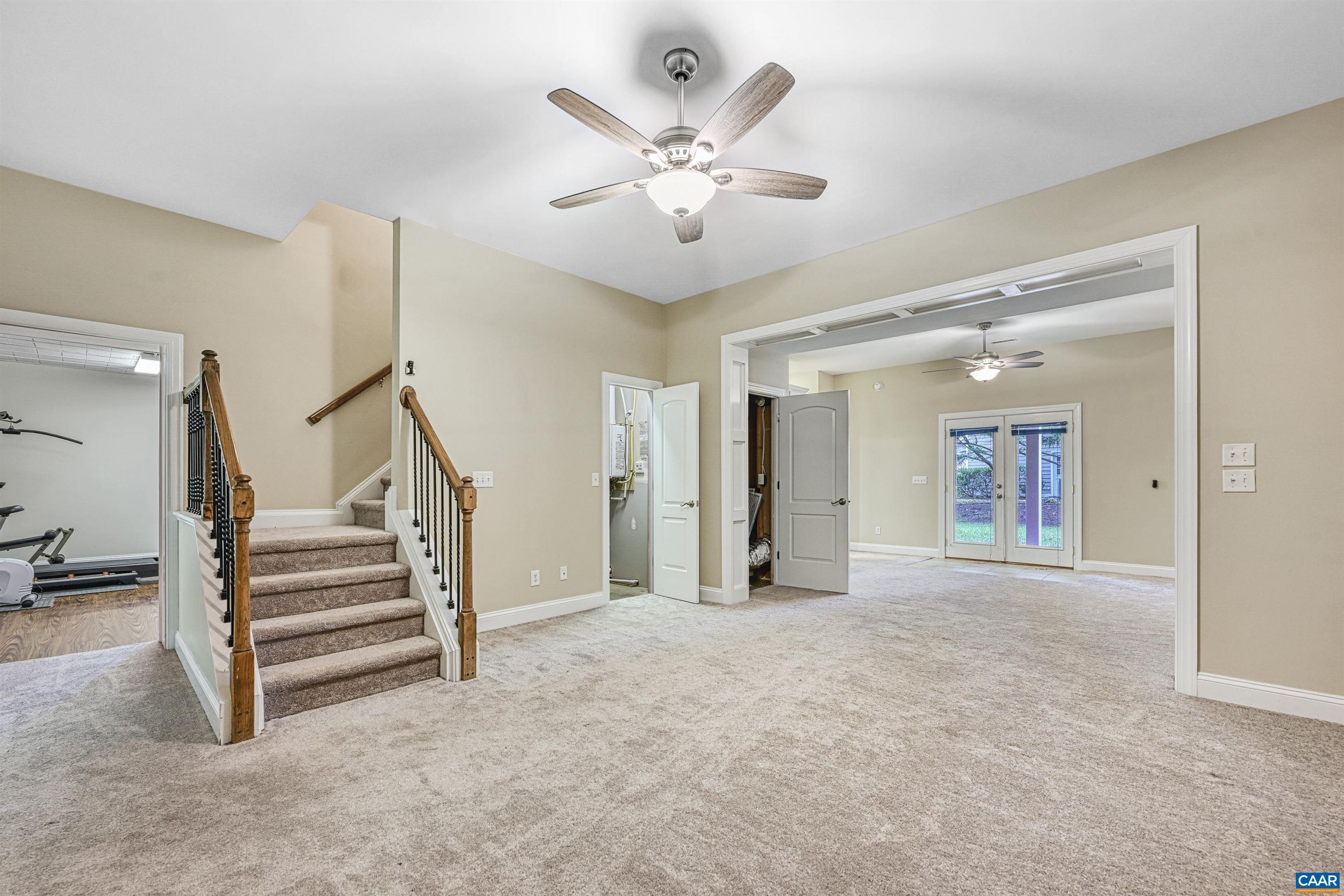 4885 Mechums River Road Charlottesville, VA 22901 - Photo 44 of 72 a view of an empty room with a ceiling fan