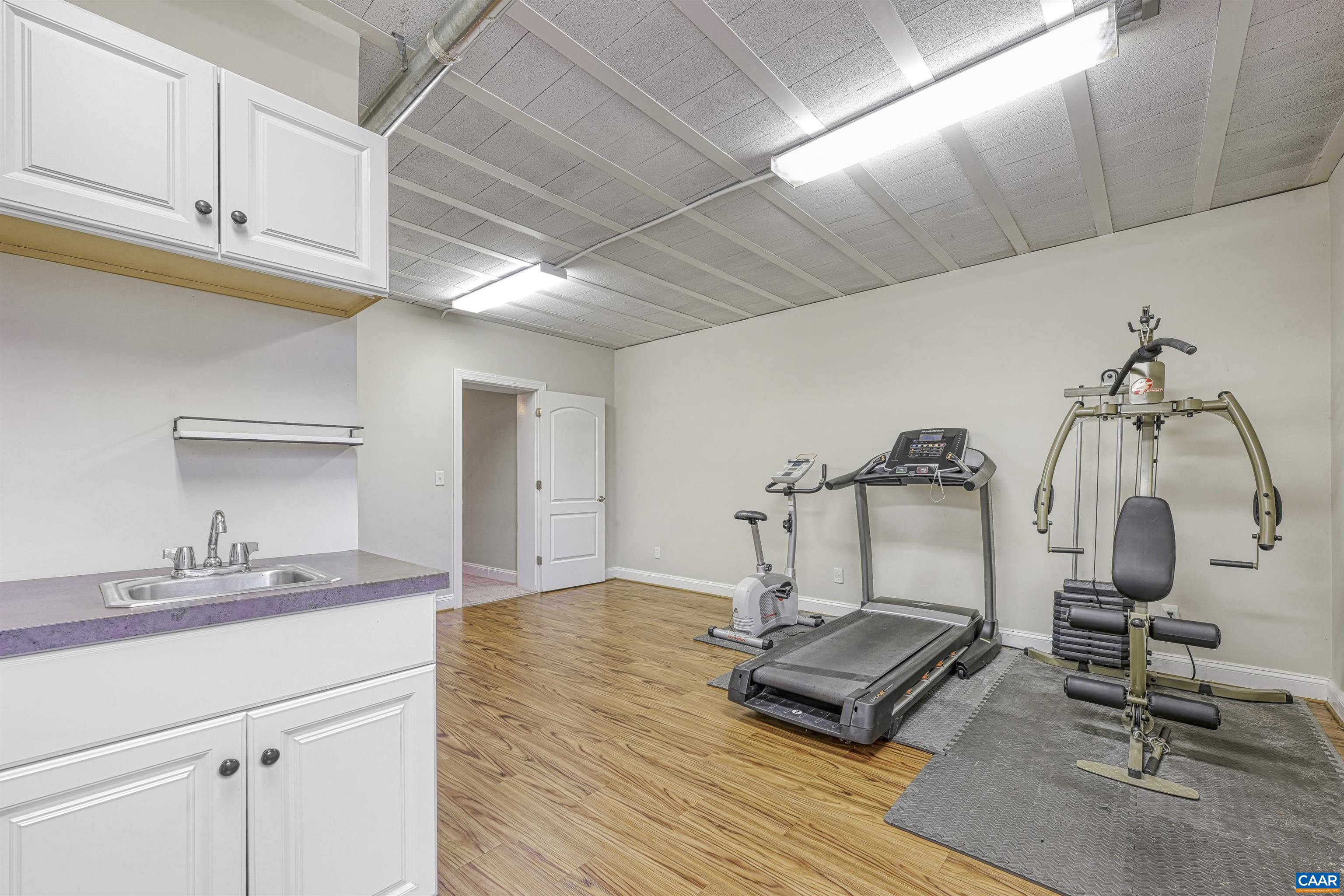 4885 Mechums River Road Charlottesville, VA 22901 - Photo 48 of 72 a room with a sink and gym equipment