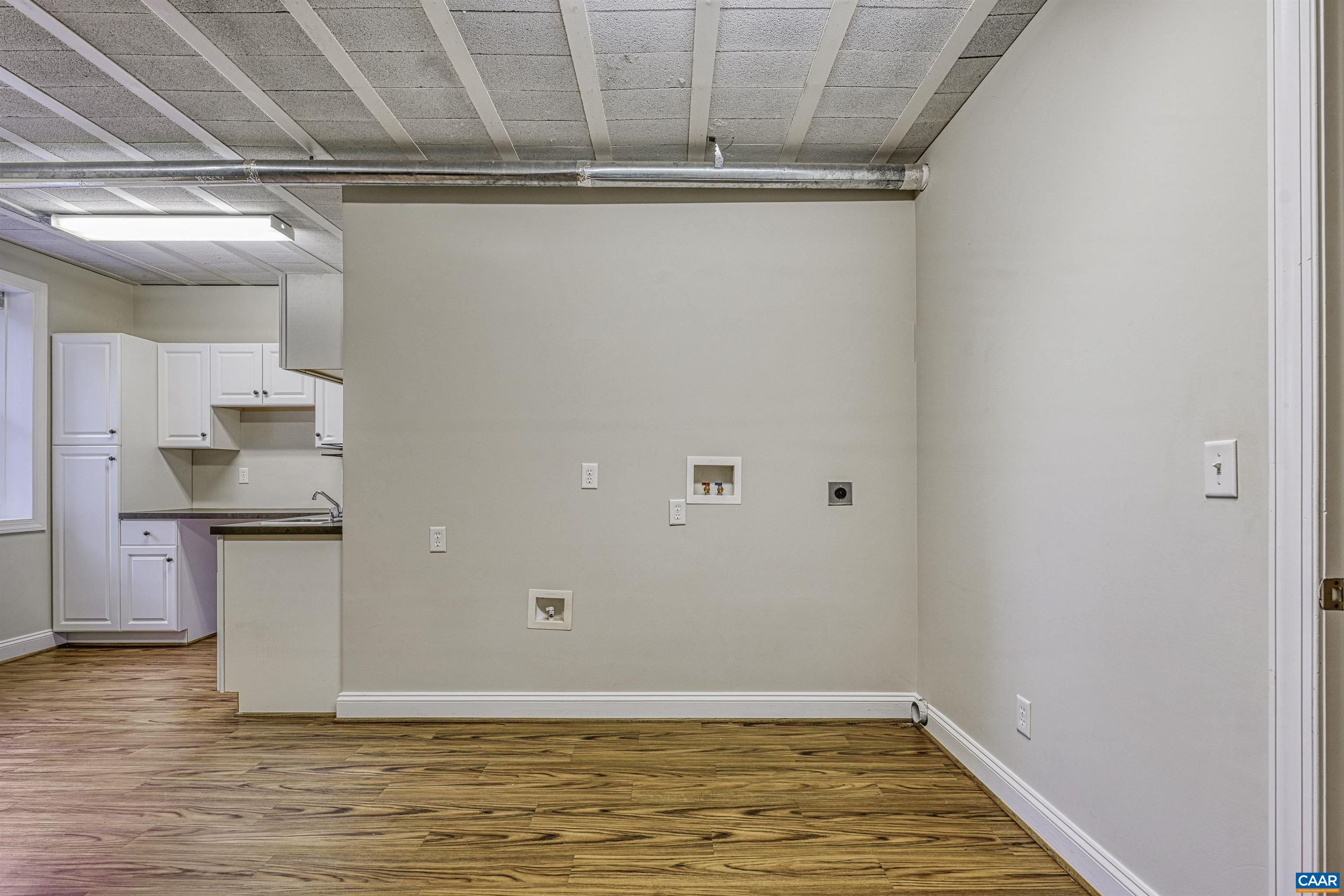 4885 Mechums River Road Charlottesville, VA 22901 - Photo 49 of 72 a view of a storage & utility room with wooden floor