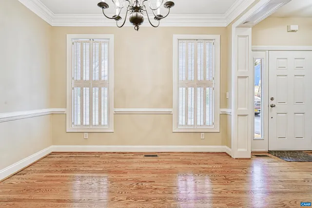 a kitchen with stainless steel appliances granite countertop a stove and a white cabinets