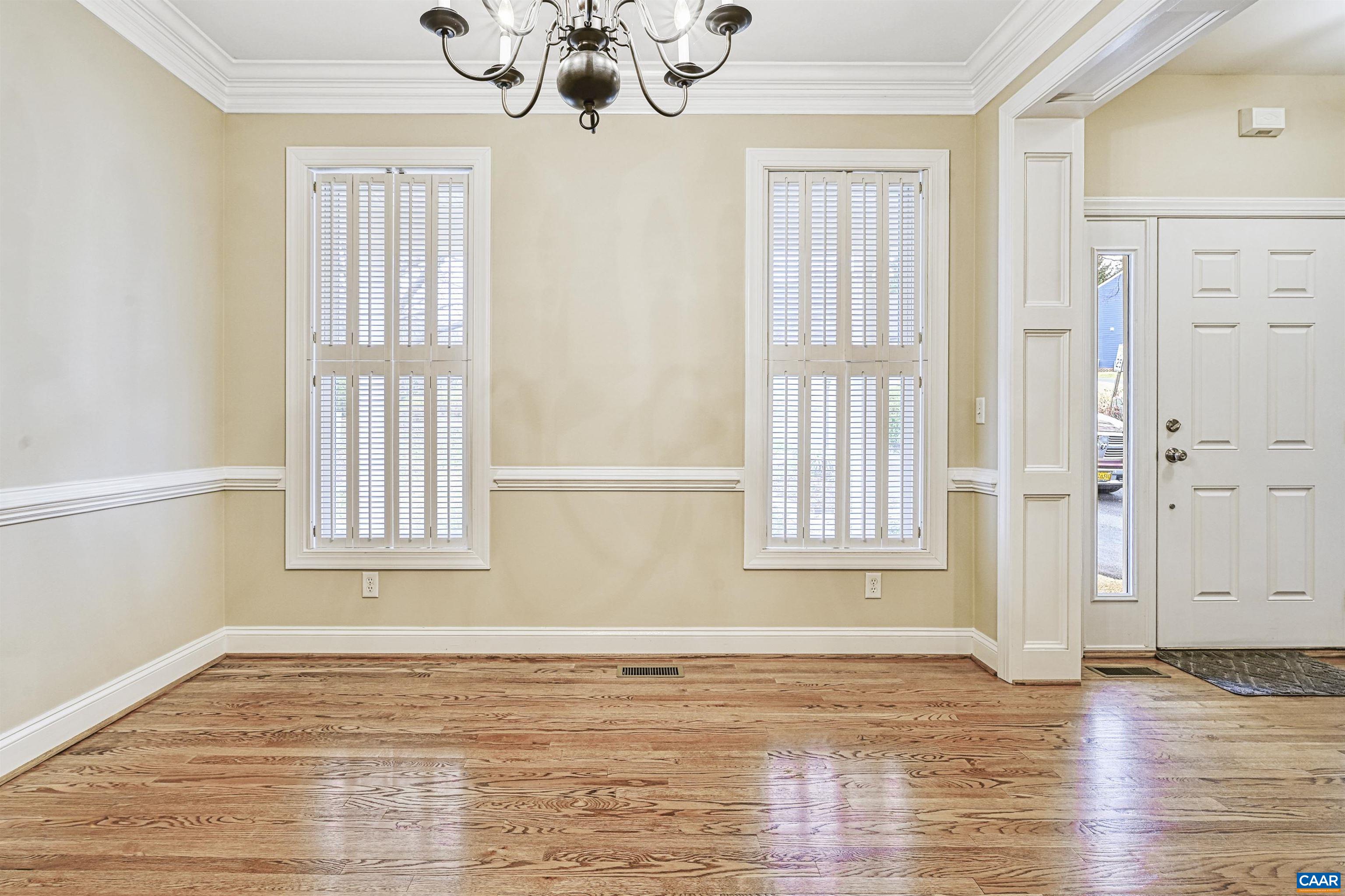 4885 Mechums River Road Charlottesville, VA 22901 - Photo 8 of 72 a view of an empty room with wooden floor and a window
