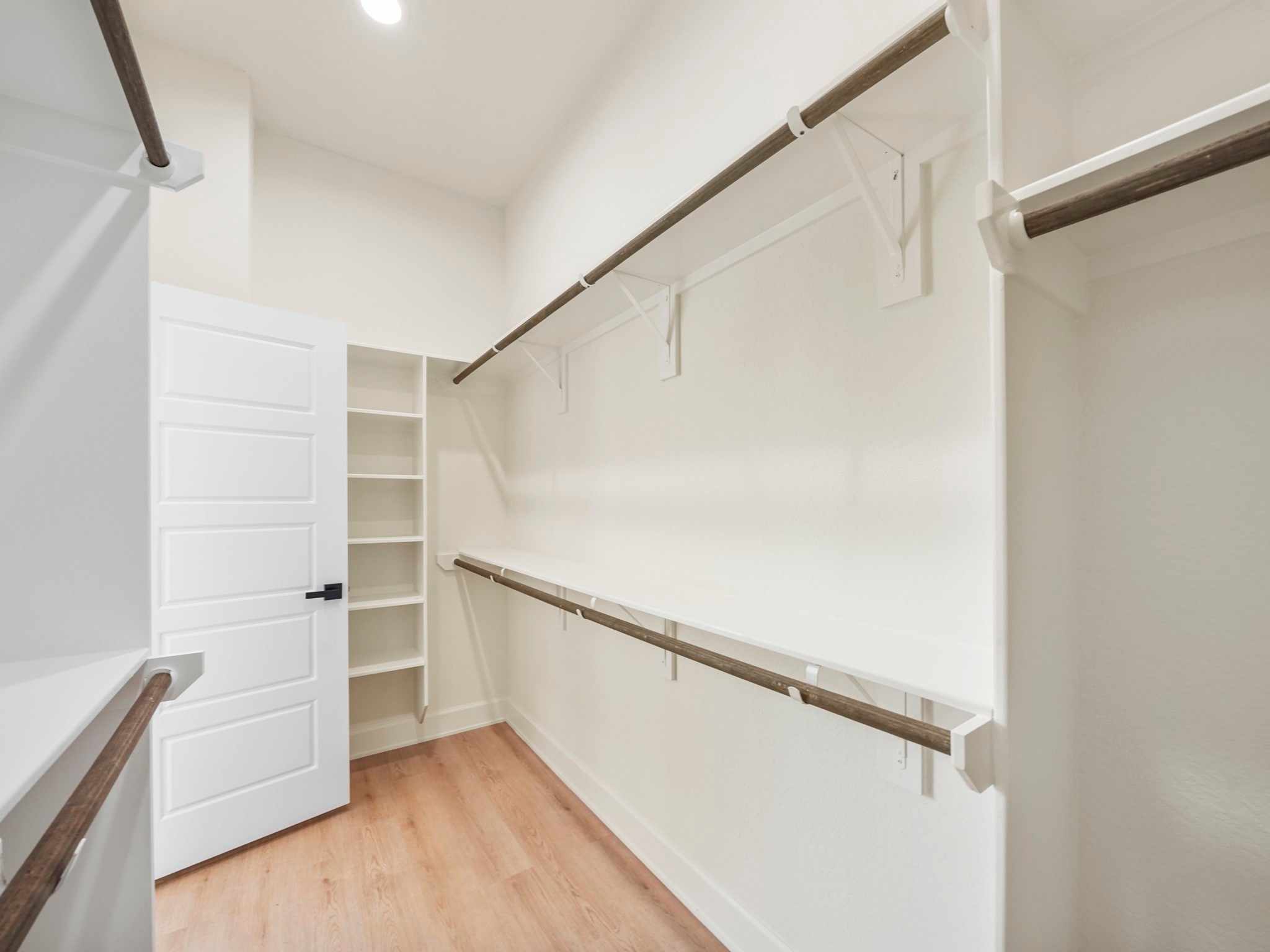 3548 Seabrook Street Houston, TX 77021 - Photo 13 of 19 a view of walk in closet with empty racks