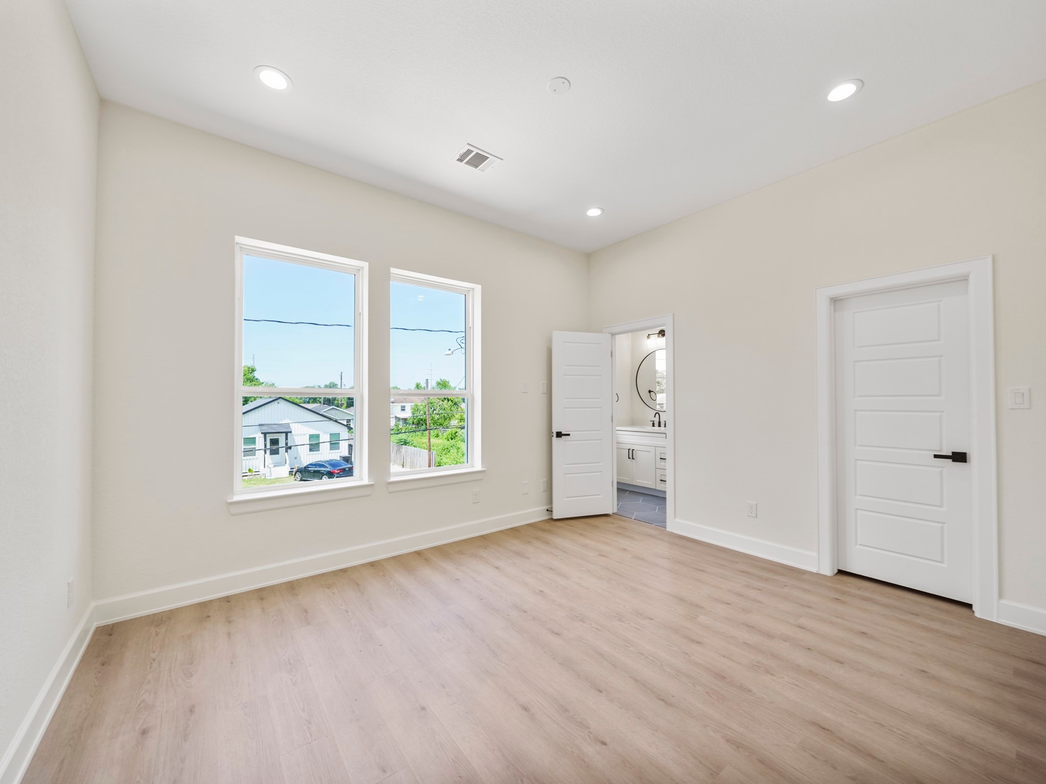 3548 Seabrook Street Houston, TX 77021 - Photo 14 of 19 wooden floor in an empty room with a window