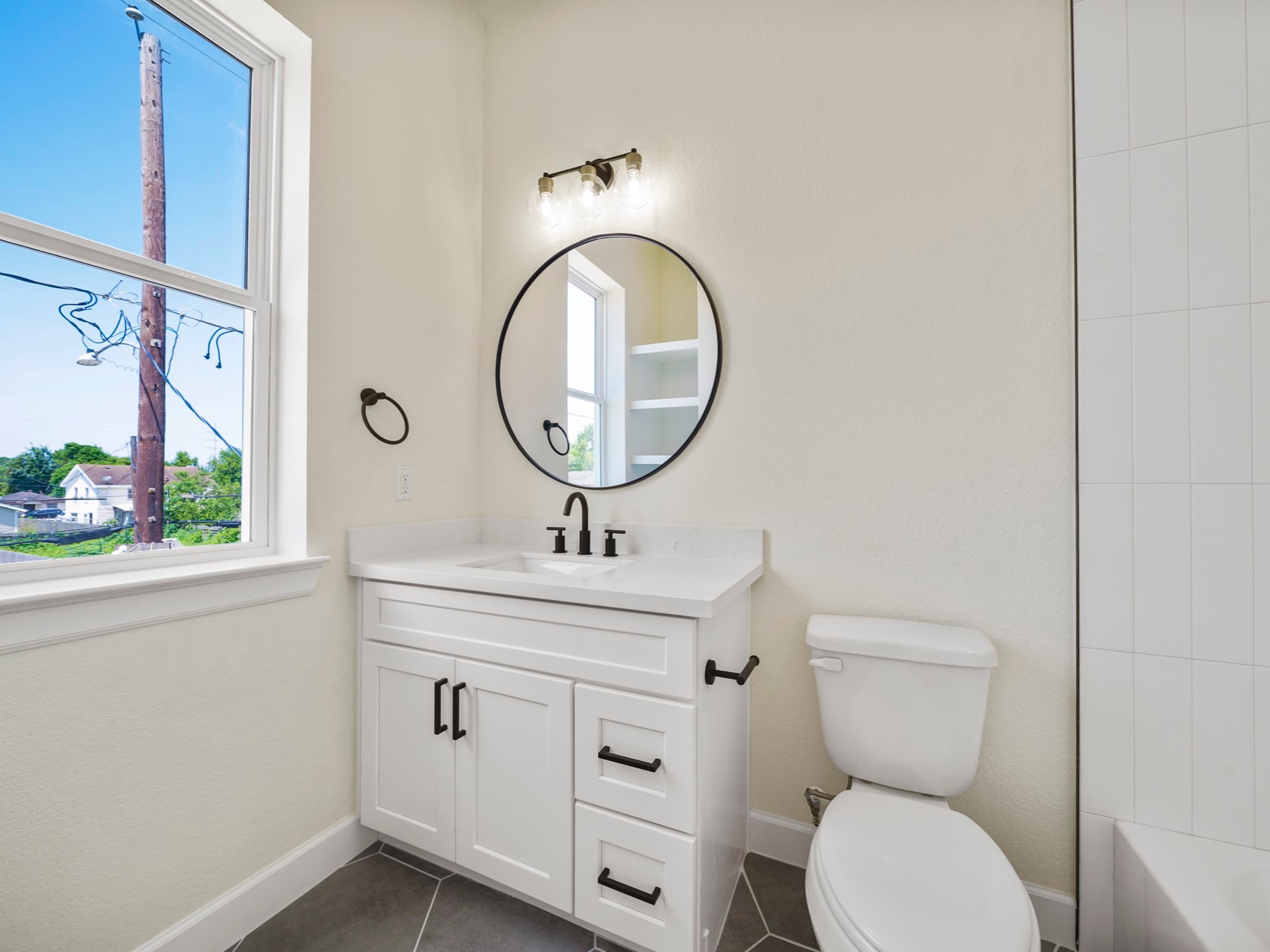 3548 Seabrook Street Houston, TX 77021 - Photo 15 of 19 a bathroom with a toilet a sink and a mirror