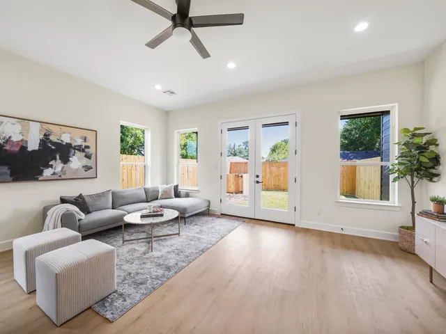 a living room with furniture and a large window