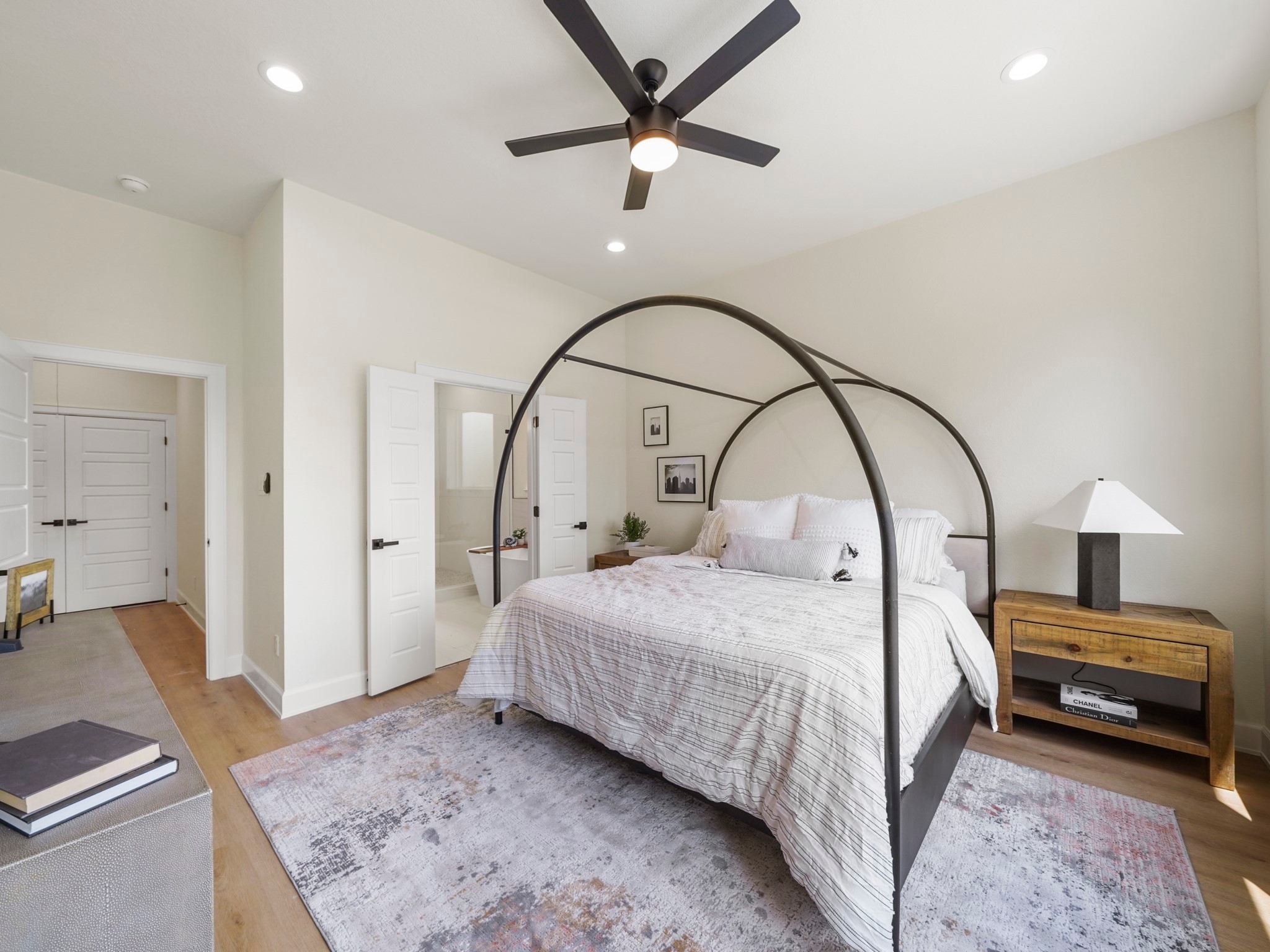 3548 Seabrook Street Houston, TX 77021 - Photo 9 of 19 a bedroom with a bed a couch and a chandelier