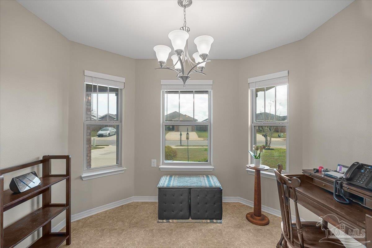 5797 Corkscrew Court Pace, FL 32571 - Photo 14 of 43 a living room with furniture and a window