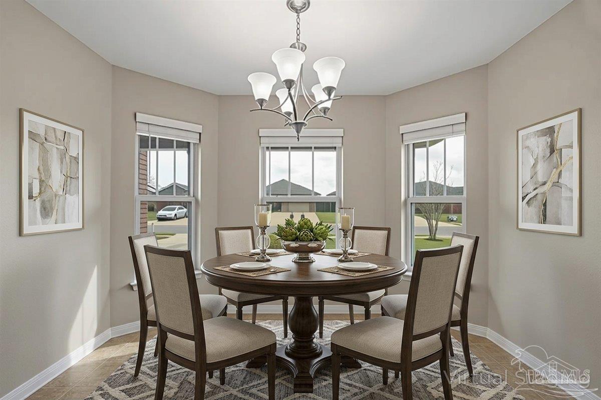 5797 Corkscrew Court Pace, FL 32571 - Photo 15 of 43 a view of a dining room with furniture window and outside view