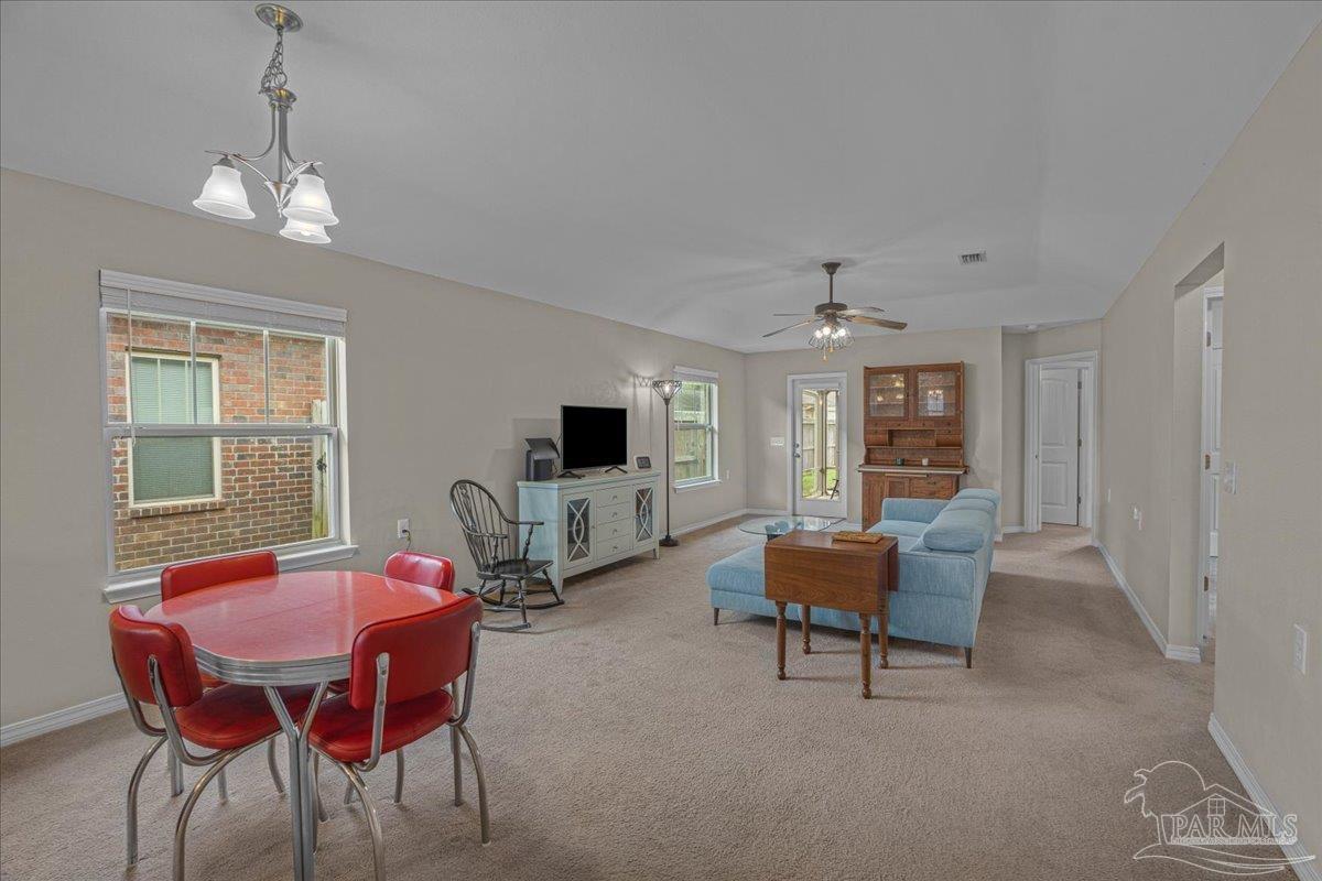 5797 Corkscrew Court Pace, FL 32571 - Photo 17 of 43 a view of a livingroom with furniture and window