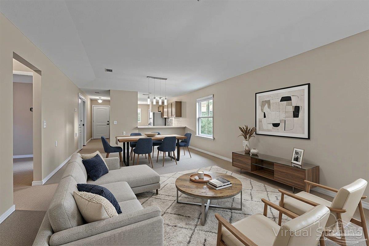 5797 Corkscrew Court Pace, FL 32571 - Photo 24 of 43 a living room with furniture and a wooden floor