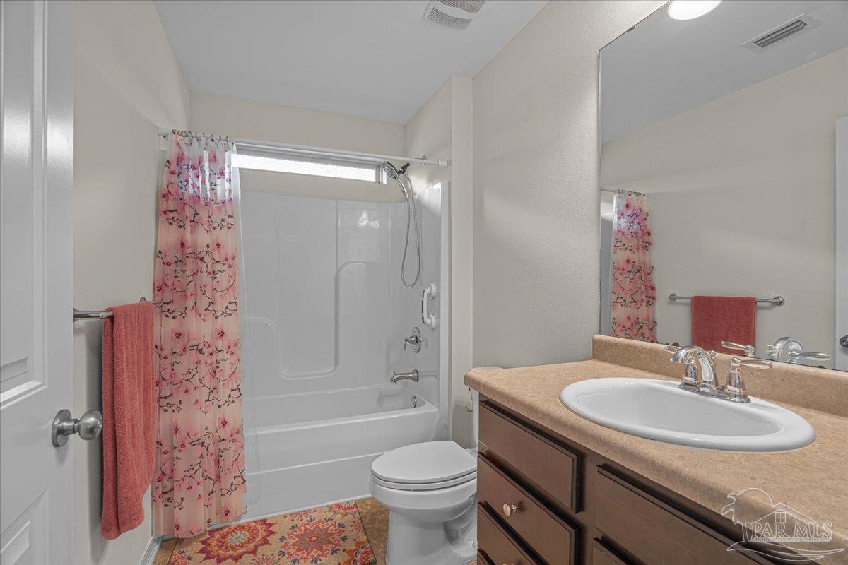 5797 Corkscrew Court Pace, FL 32571 - Photo 34 of 43 a bathroom with a sink toilet tub and shower