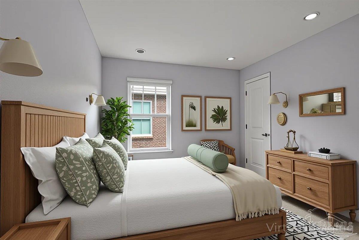 5797 Corkscrew Court Pace, FL 32571 - Photo 36 of 43 a bedroom with a large bed and a window