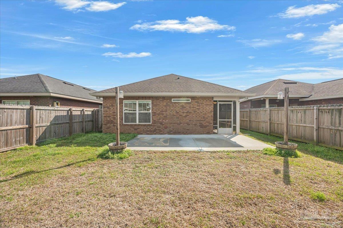 5797 Corkscrew Court Pace, FL 32571 - Photo 41 of 43 a house with swimming pool in front of it