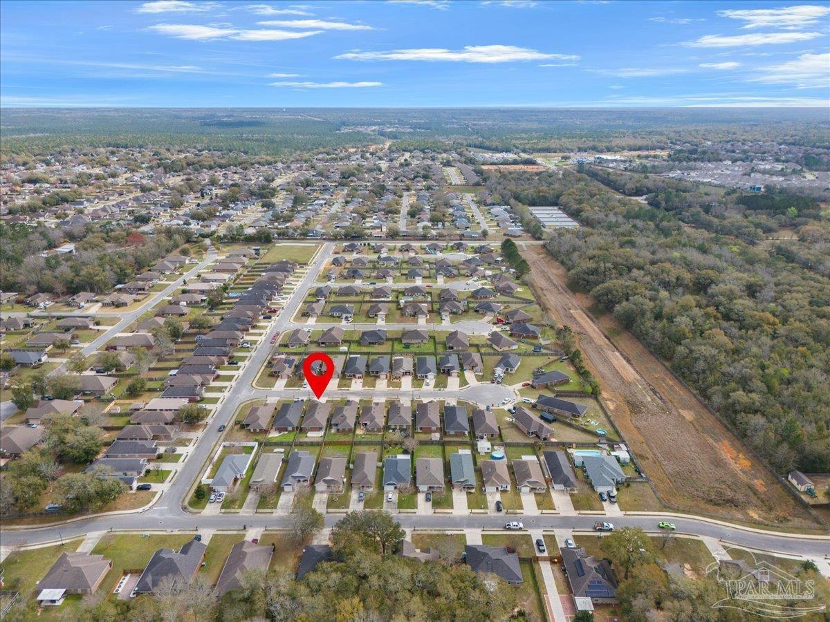 5797 Corkscrew Court Pace, FL 32571 - Photo 7 of 43 an aerial view of residential houses with outdoor space