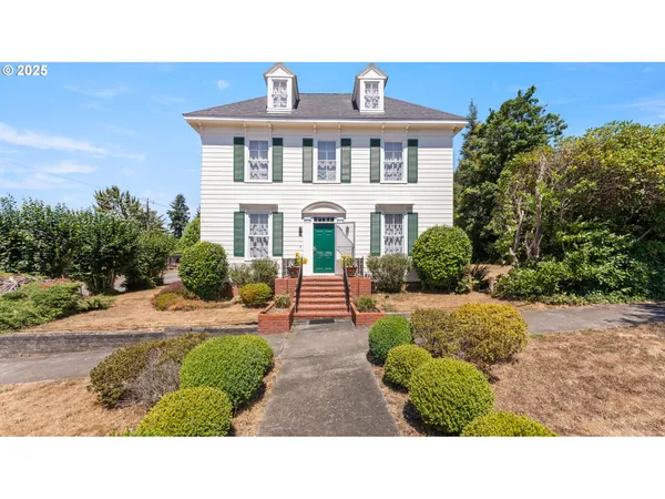 a view of a front of a house with a yard