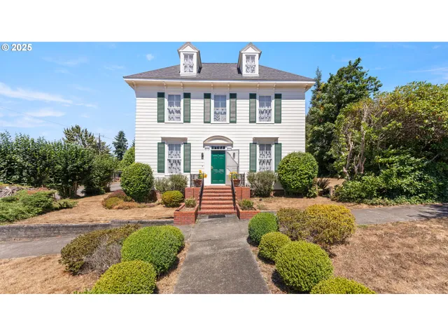 a view of a front of a house with a yard