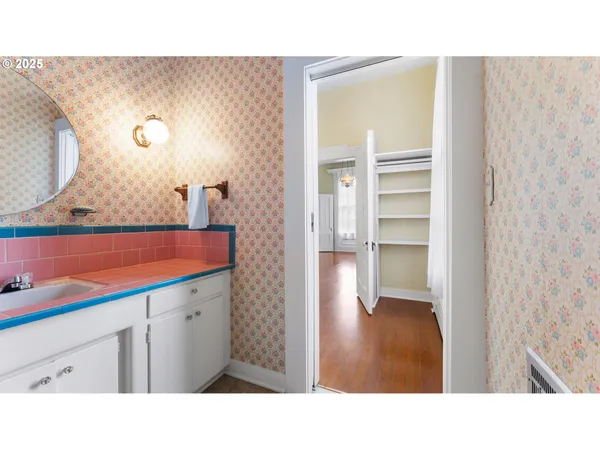 a bathroom with a sink a mirror and a bathtub