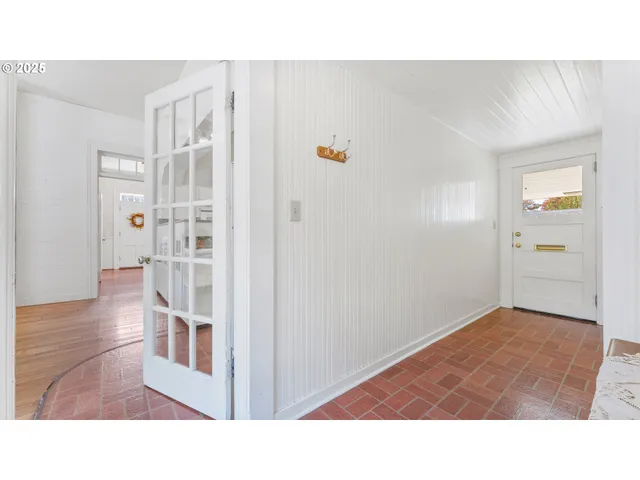 a bathroom with a sink and a glass door