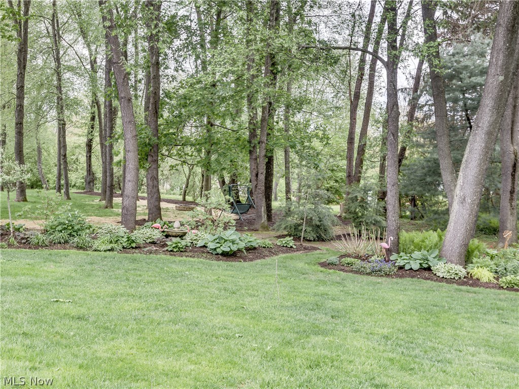 876 Hunter Ridge Circle Fairlawn, OH 44333 - Photo 33 of 35 Mature trees and perennial beds add up to excellent privacy and carefree gardening