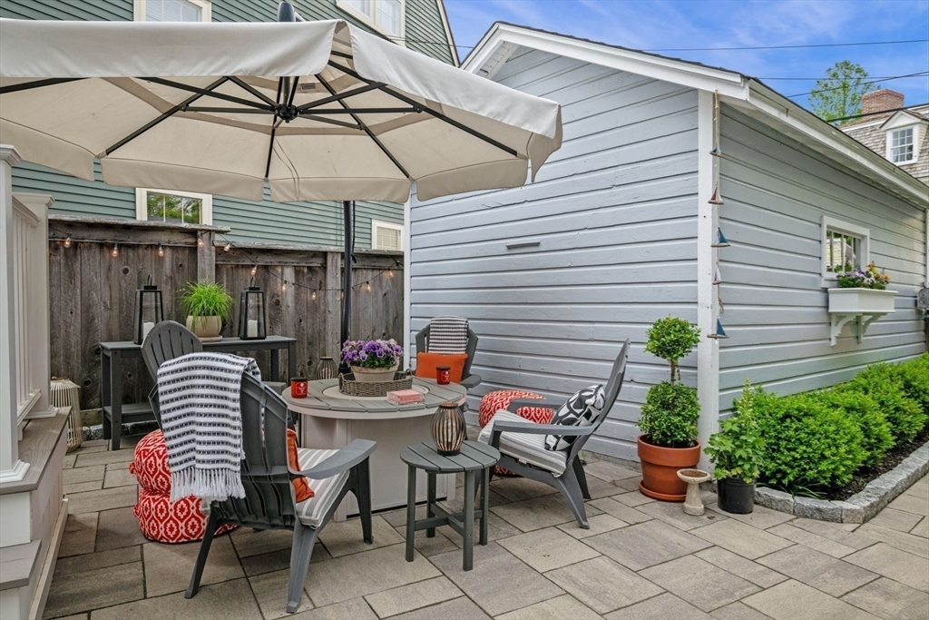 31 Franklin Street Marblehead, MA 01945 - Photo 28 of 35 a table and chairs in patio of the house