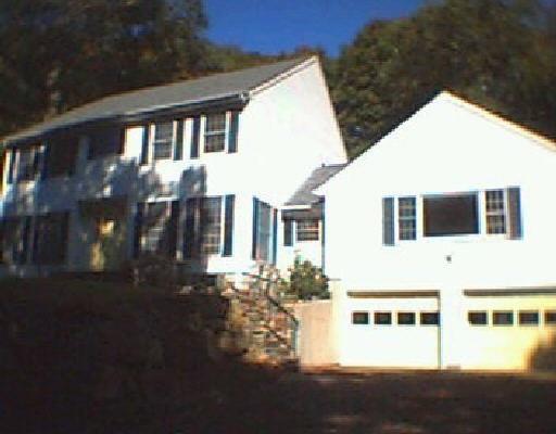 a view of house with yard