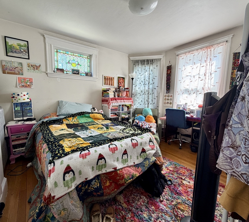 a bedroom with bed and a window