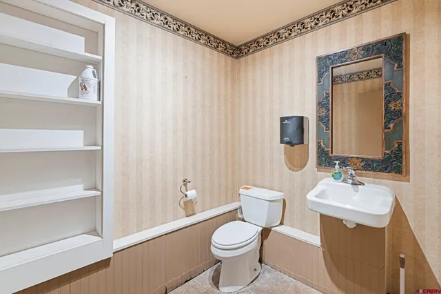 a workspace with a chair and painted walls