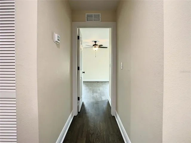 a bathroom with a sink vanity and mirror