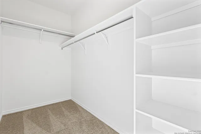 a view of an empty walk in closet