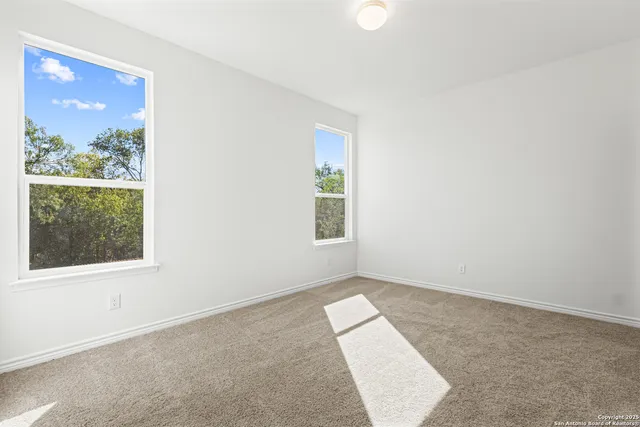 an empty room with windows